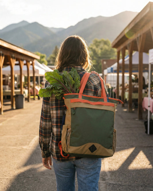 Woman carrying the (R)evolution 25L Convertible Carryall Bags & Accessories by United By Blue - sold by Kempain Family Outfitters