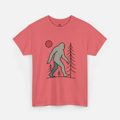 Flat lay of the Sasquatch Red Moon Forest Tee in coral silk color on a white background, featuring a minimalist line art design of Bigfoot walking through pine trees under a red moon