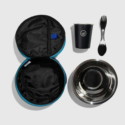 The Meal Kit from United By Blue displayed on a white background open with all the components spork, cup, bowl, and travel case.