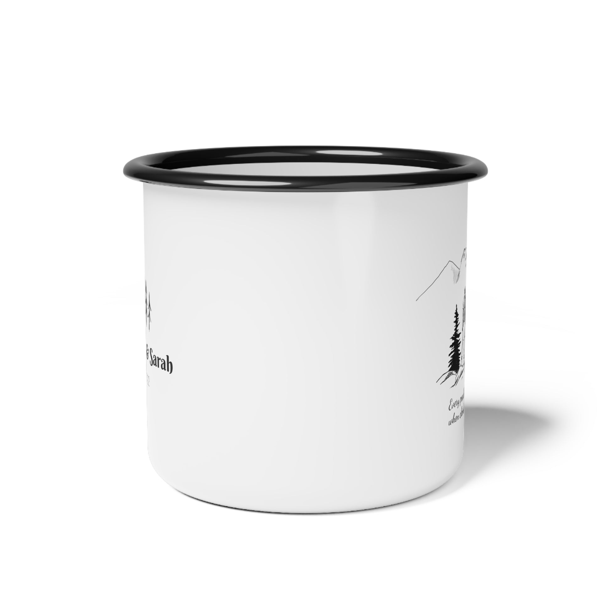 White enamel mug with black rim and black text and graphics on a white background