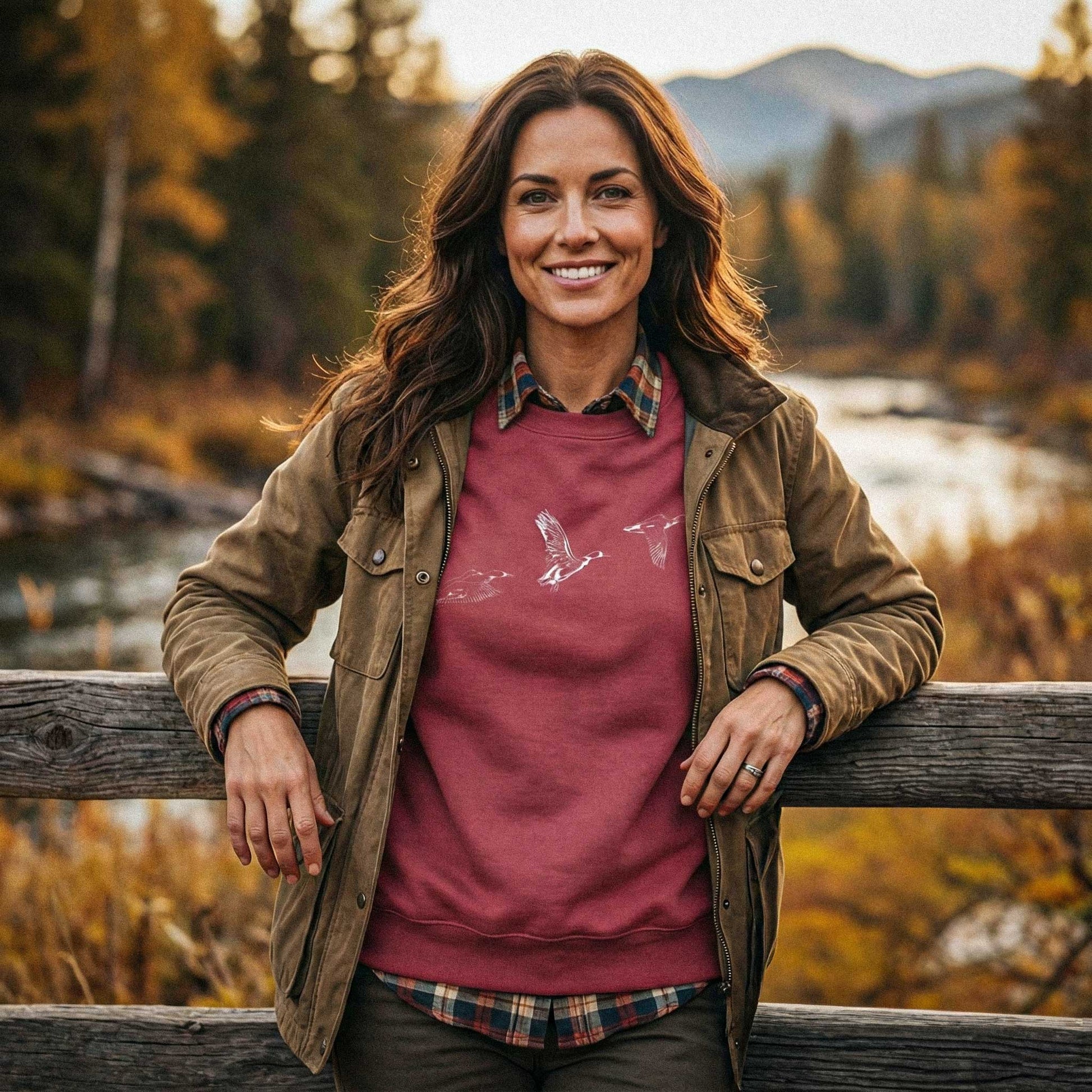 Lifestyle view of The Three Ducks flight study sweatshirt worn in an outdoor setting, showcasing the heritage-grade naturalist aesthetic.