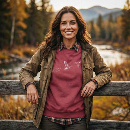 Lifestyle view of The Three Ducks flight study sweatshirt worn in an outdoor setting, showcasing the heritage-grade naturalist aesthetic.