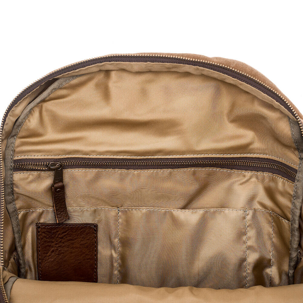 The inside zipper view of the Waxed Canvas Backpack in Smoke-Brown by Mission Mercantile Leather Goods.