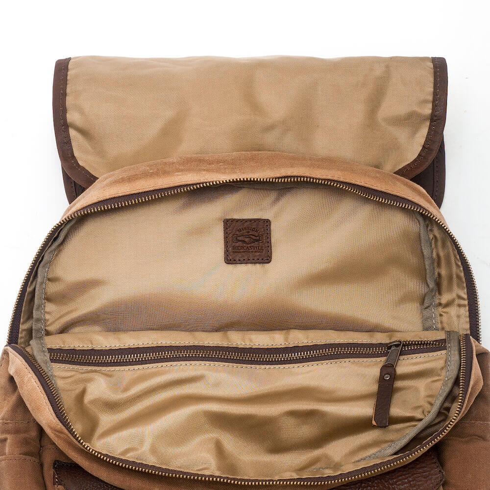 Top compartment view of the Waxed Canvas Backpack in Smoke-Brown by Mission Mercantile Leather Goods.