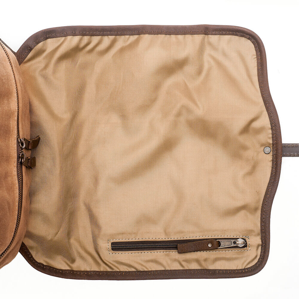 The Waxed Canvas Backpack in Smoke-Brown open storage and zipper by Mission Mercantile Leather Goods.