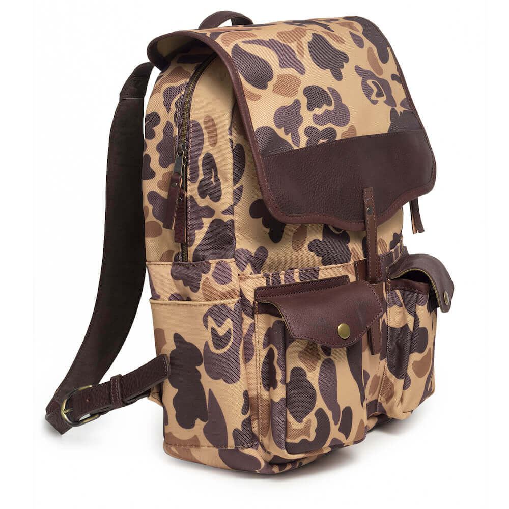 Side view of The Waxed Canvas Backpack in Smoke-Vintage-Camo by Mission Mercantile Leather Goods.