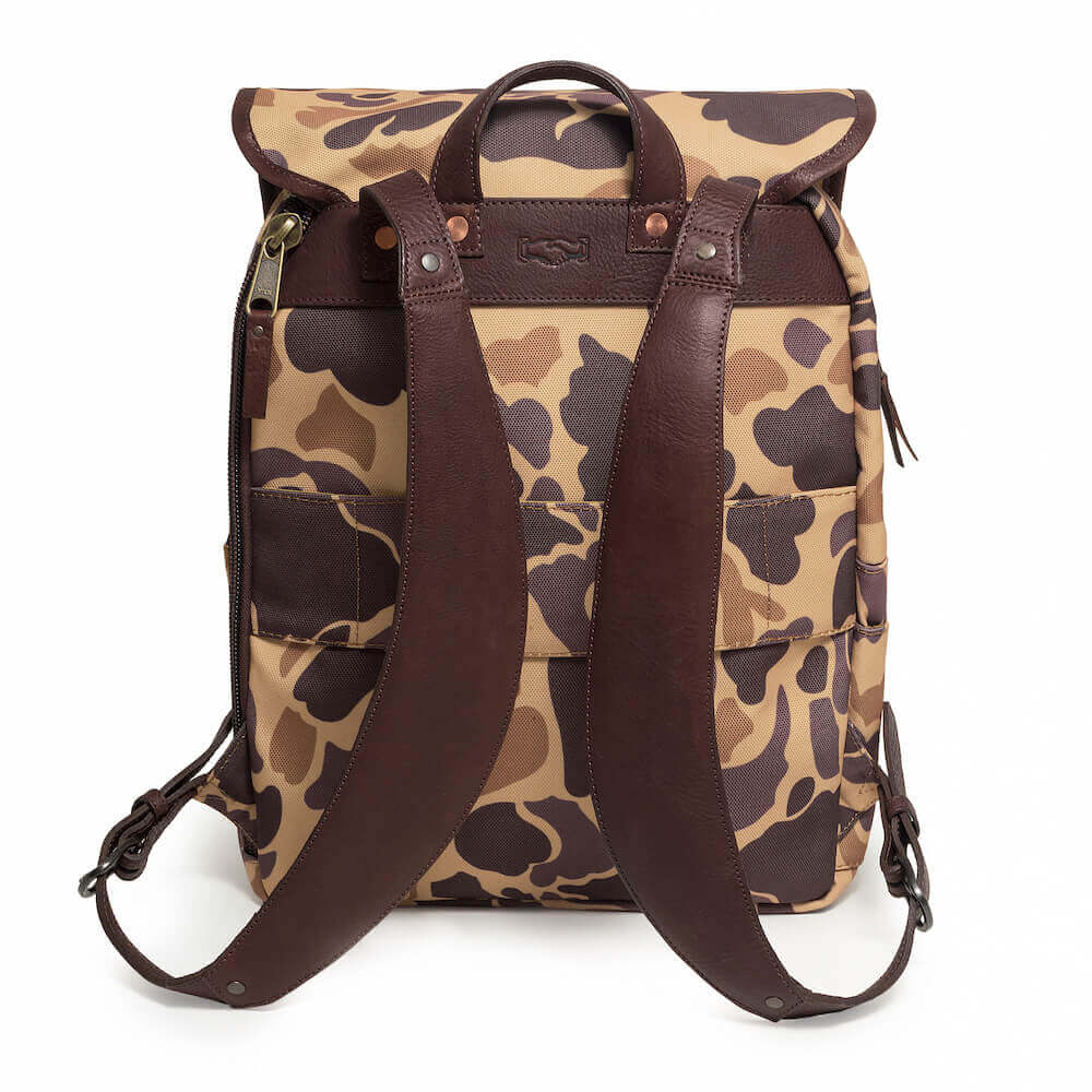Back strap view of The Waxed Canvas Backpack in Smoke-Vintage-Camo by Mission Mercantile Leather Goods.