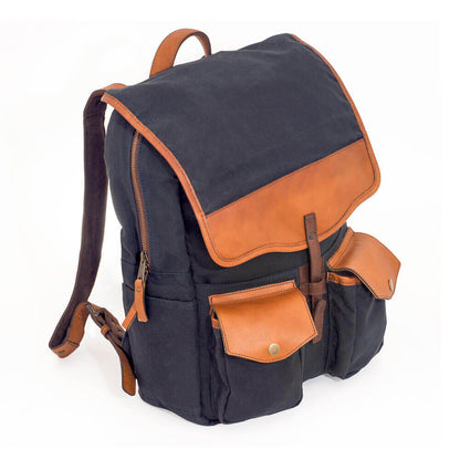 Angle side view of The Waxed Canvas Backpack in hickory-navy by Mission Mercantile Leather Goods.
