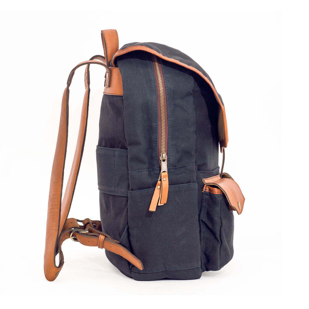 Side view of The Waxed Canvas Backpack in hickory-navy by Mission Mercantile Leather Goods.