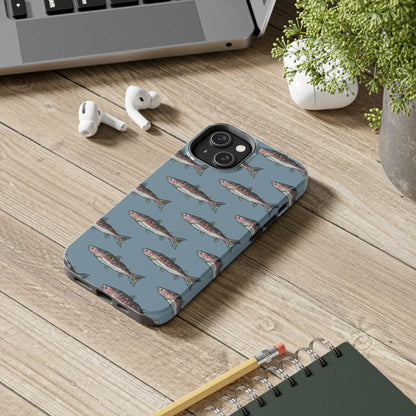Illustrated rainbow trout durable phone case for anglers on a desk lifestyle view.  Compatible with iPhone and Samsung Models. 
