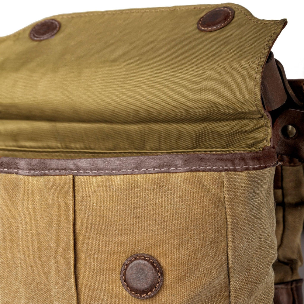 A close up of the brown White Wing Waxed Canvas Hunting Heritage Bird Bag Trio by Mission Mercantile Leather Goods showing the craftsmanship of the stitching and fabric up close.