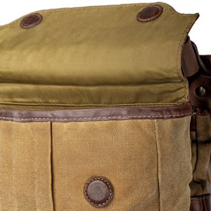 A close up of the brown White Wing Waxed Canvas Hunting Heritage Bird Bag Trio by Mission Mercantile Leather Goods showing the craftsmanship of the stitching and fabric up close.