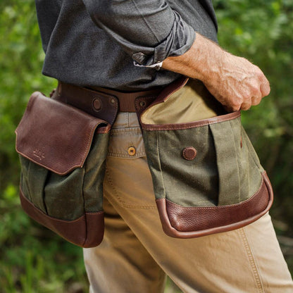 The smoke forest White Wing Waxed Canvas Hunting Heritage Bird Bag Trio by Mission Mercantile Leather Goods worn by a man outdoors.