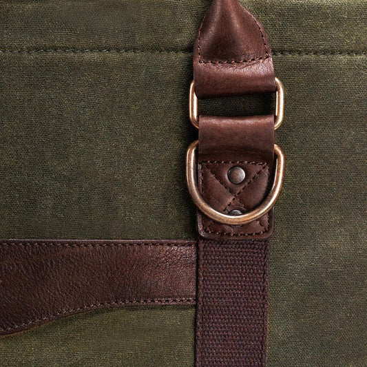 Detail  of fabric and buckle on the White Wing Waxed Canvas Large Cooler - 35L in Smoke-Forest by Mission Mercantile Leather Goods.