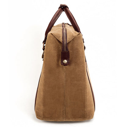 Side view of the White Wing Waxed Canvas Large Cooler - 35L in Smoke-Brown by Mission Mercantile Leather Goods.