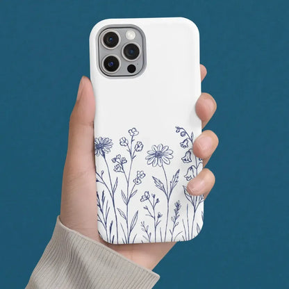 Wildflower Blue Phone Case held in hand, highlighting minimalist wildflower illustration in soft blue tones.