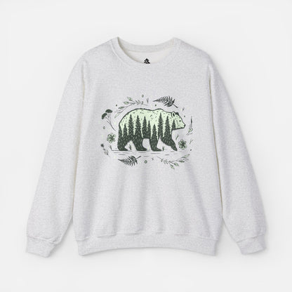 Wandering Bear Women's Sweatshirt in Grey displayed flat on a white background, highlighting its cozy crewneck design and wilderness-themed illustration.