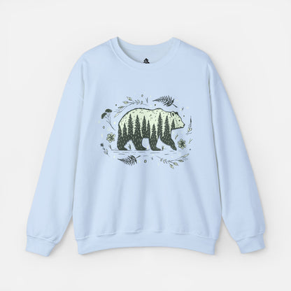 Wandering Bear Women's Sweatshirt in Light Blue displayed flat on a white background, highlighting its cozy crewneck design and wilderness-themed illustration.